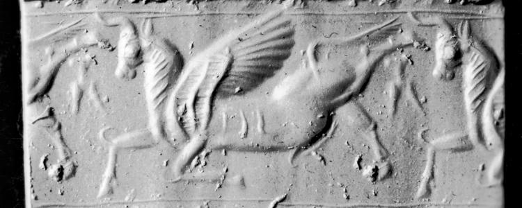 A winged bull depicted on an on archaeological artifact from the Assyrian empire between 1400 and 1200 BC. Cylinder Seal with Winged Bull - Walters Art Museum Licensed under CC0.